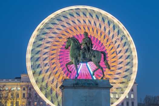 Place Bellecour statue of King Louis XIV by night, Lyon France 