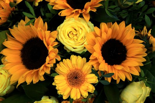 Yellow bridal arrangement with gerberas, sunflowers and roses