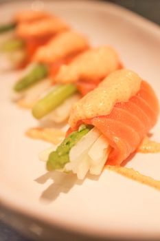 Closeup salmon mentai sauce  on white plate, stock photo