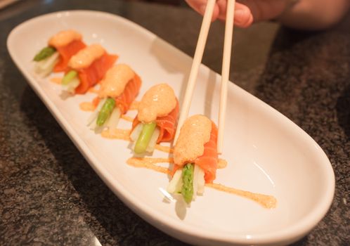 Salmon mentai sauce  on white plate, stock photo