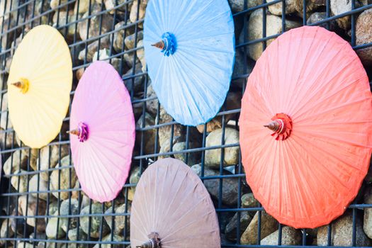 Brick wall decorated with umbrellas, stock photo