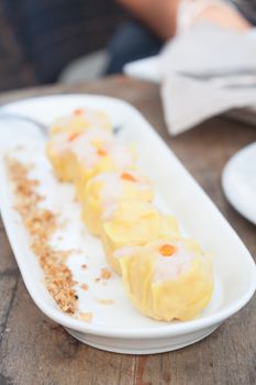 Shrimp dumplings on white plate, stock photo