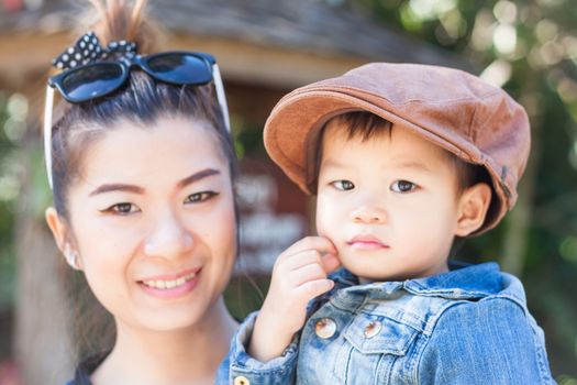 Mother and son looking at camera, stock photo