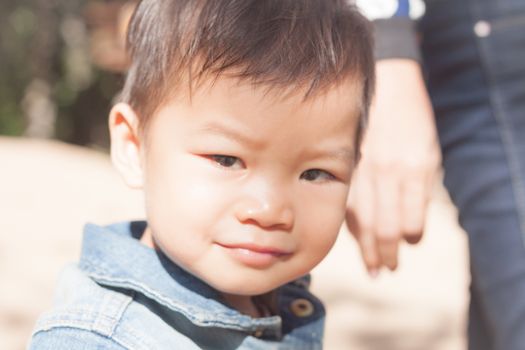 Little asian boy looking at camera , stock photo