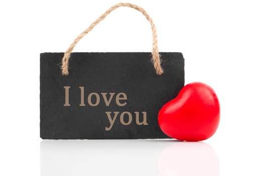 red heart with blackboard, on white wooden background
