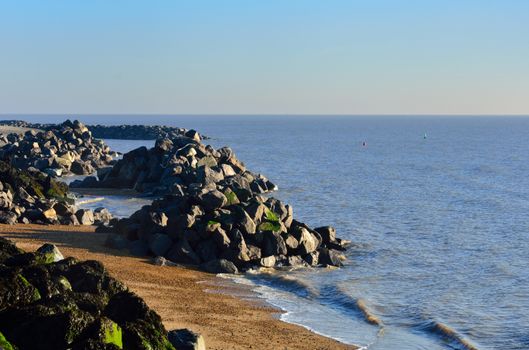 rocks stretching into sea