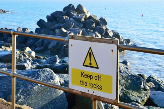 keep off rocks sign