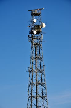 Telecommunications mast with blue sky