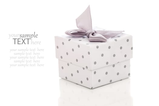 gift box present with satin bow isolated on white