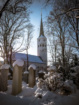 A Snowy Church And Graveyard In The Winter