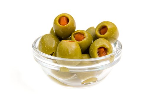 Stuffed olives on bowl on white background
