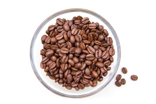 Coffee beans on the bowl on a white background seen from above