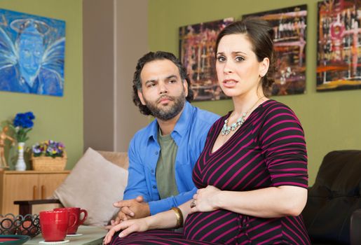 Mixed married couple anxious about their pregnancy
