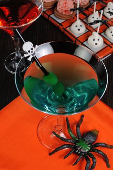 Cocktail with olives straw decorated with a skull
