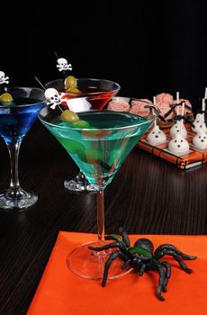 Cocktail with olives straw decorated with a skull