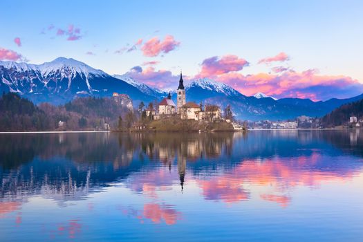 Sunset view of Julian Alps, Lake Bled with St. Marys Church of the Assumption on the small island; Bled, Slovenia, Europe.