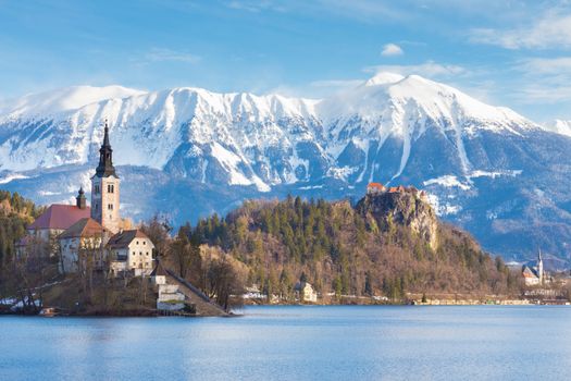 Panoramic view of Julian Alps, Lake Bled with St. Marys Church of the Assumption on the small island; Bled, Slovenia, Europe. 