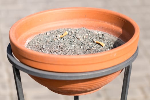 Ashtray with metal clay in  the harbour