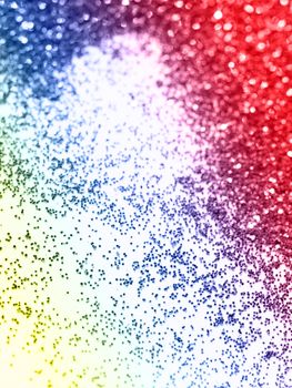 Multicolor glitter on light background - macro photo