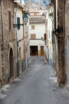  street with traditional house buildings, Pollenca town, Majorca island, Spain 