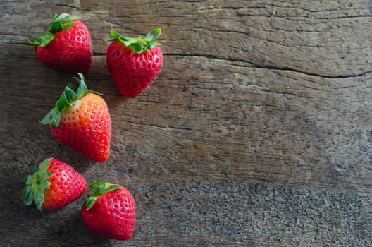 still life fresh strawberries over wooden background