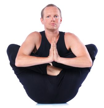 Young and handsome man doing yoga. Isolated on white backgraund