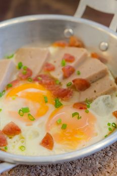 fried eggs and sliced chinese sausage, vietnamese sausage , asian breakfast