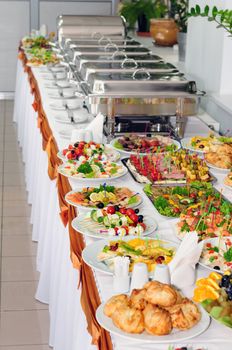 chafing dishes at table ready for wedding catering