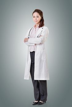 Friendly Asian doctor woman, full length portrait isolated.