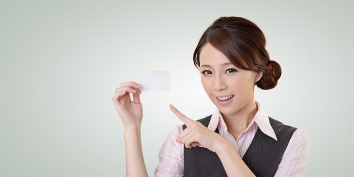 Cheerful business woman holding blank business card, closeup portrait with clipping path.