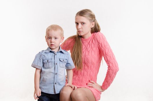 Young beautiful mother scolds her rebellious and moody three year old boy