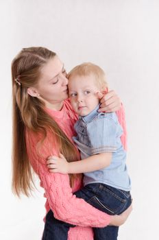 Young beautiful girl hugging his three sons