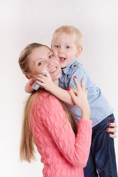 Young beautiful girl hugging his three sons