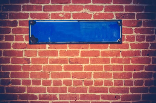 A Blank Blue Sign For Your Text On A Red Brick Wall