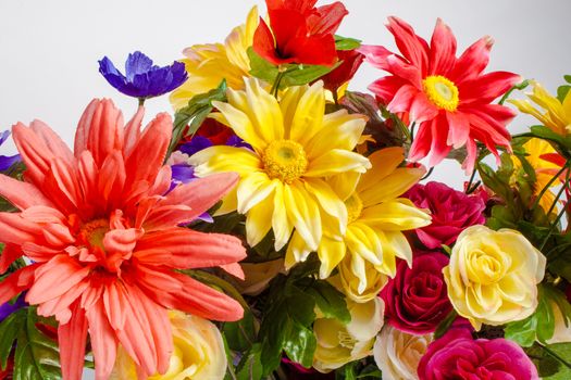 a detail of colorful fabric flowers