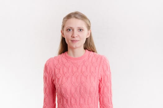 Portrait of a young emotional beautiful girl of the European appearance on a white background