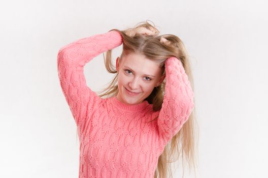 Portrait of a young emotional beautiful girl of the European appearance on a white background