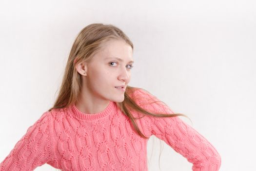 Portrait of a young emotional beautiful girl of the European appearance on a white background