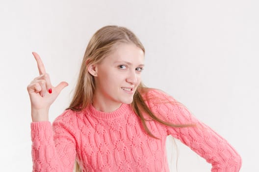 Portrait of a young emotional beautiful girl of the European appearance on a white background