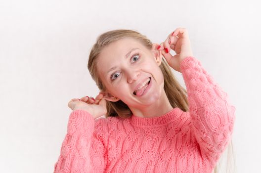 Portrait of a young emotional beautiful girl of the European appearance on a white background
