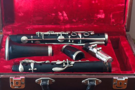 clarinet, wind instrument, disassembled and placed in the case