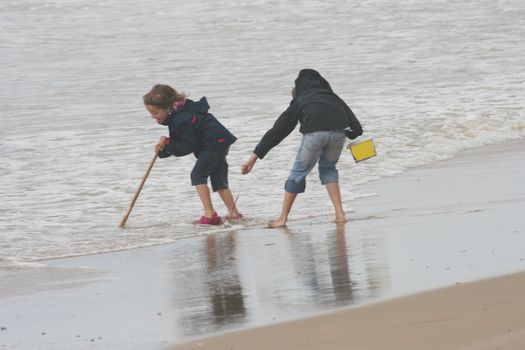 two blonde sisters on the beach