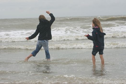 two blonde sisters on the beach 