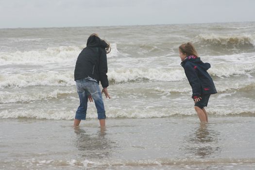 two blonde sisters on the beach 