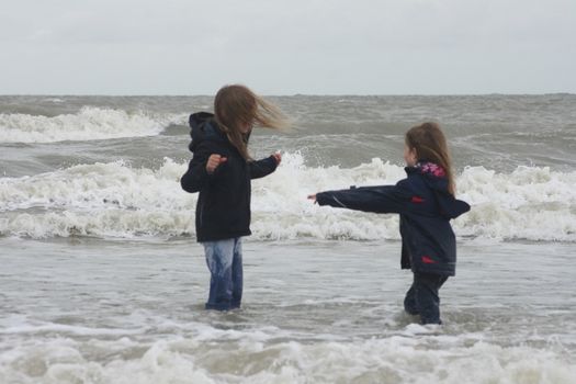 two blonde sisters on the beach 