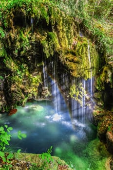 Beautiful waterfall deep into the forest.