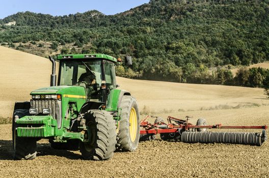Farmers working on their land in Navarra, Spain