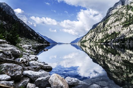 Beautiful river into the Pyrenees mountains, with peaceful water.
