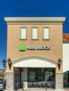 GRANADA HILLS, CA/USA - JANUARY 7, 2015: H & R Block Retail Exterior. H & R Block is a tax preparation company in the United States.