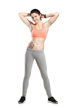 fitness girl posing against white background